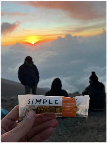 An image of a SIMPLE Bar on a sunset hiking trip.